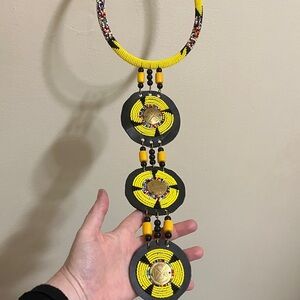 beaded necklace yellow and black glass beads,hand carved brass,leather